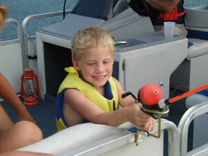 Rod holders with a boy holding a fishing rod