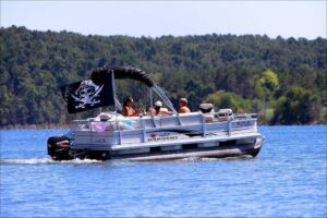 Pontoon boat with a pirates flag